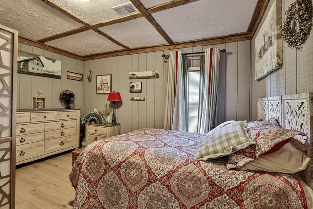 1851 Parker Rd, Goshen Twp, OH 45150 - bedroom featuring wood finished floors, a textured ceiling, and wooden walls