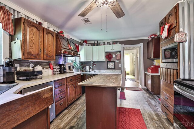 1851 Parker Rd, Goshen Twp, OH 45150 - kitchen with appliances with stainless steel finishes, dark wood-type flooring, decorative backsplash, and a ceiling fan