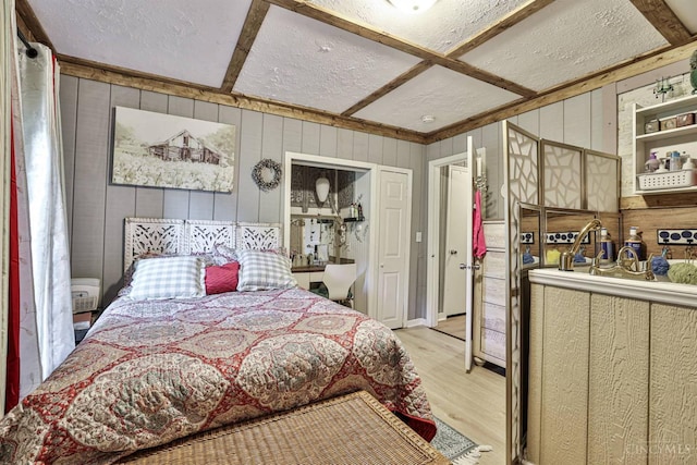 1851 Parker Rd, Goshen Twp, OH 45150 - bedroom featuring wood walls, wood finished floors, a textured ceiling, and beam ceiling