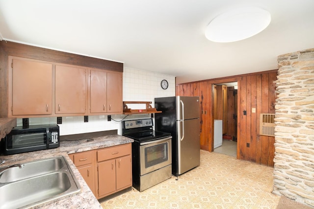 2765 Tater Ridge Rd, West Union, OH 45693 - kitchen featuring stainless steel appliances, wood walls, light countertops, and a wall unit AC