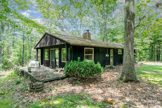 2765 Tater Ridge Rd, West Union, OH 45693 - view of front of property with a chimney, board and batten siding, and a wooden deck
