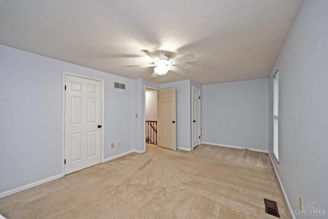 3016 Stratford Ct Unit 115, Cincinnati, OH 45140 - unfurnished bedroom with light colored carpet, a ceiling fan, and a textured ceiling
