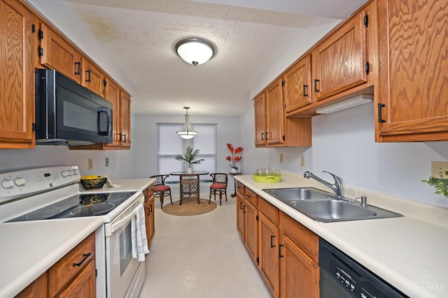 3016 Stratford Ct Unit 115, Cincinnati, OH 45140 - kitchen with black appliances, light countertops, brown cabinets, and a textured ceiling