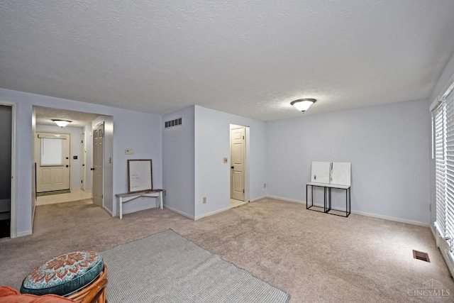 3016 Stratford Ct Unit 115, Cincinnati, OH 45140 - unfurnished living room featuring carpet floors and a textured ceiling