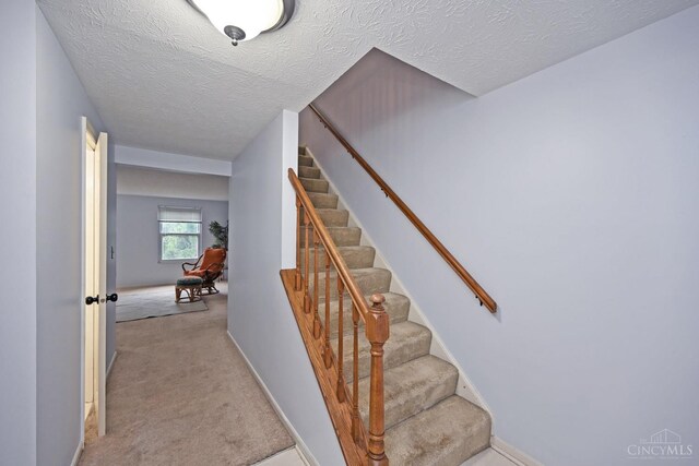 3016 Stratford Ct Unit 115, Cincinnati, OH 45140 - staircase with carpet flooring and a textured ceiling