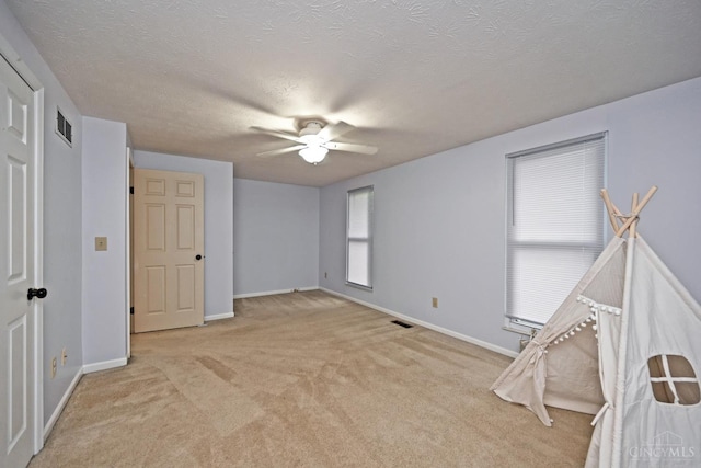 3016 Stratford Ct Unit 115, Cincinnati, OH 45140 - unfurnished bedroom with light colored carpet, a textured ceiling, and ceiling fan