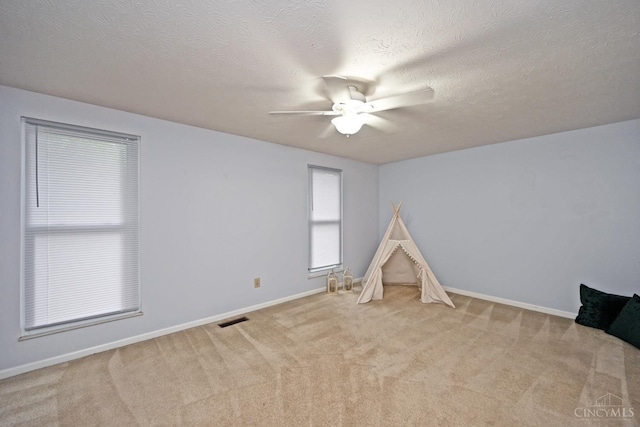 3016 Stratford Ct Unit 115, Cincinnati, OH 45140 - recreation room featuring ceiling fan, carpet flooring, and a textured ceiling