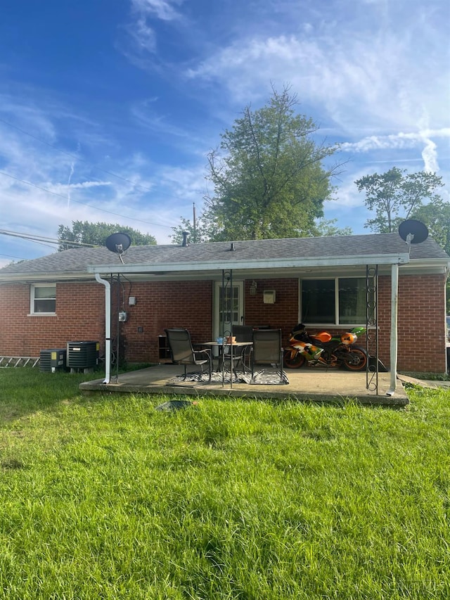 1934 Windmill, Springfield Twp, OH 45240 - rear view of property with a lawn, a patio, and brick siding