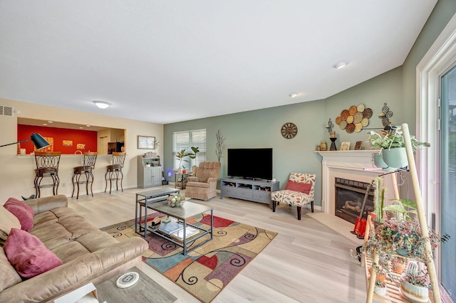 3435 Kleeman Lake Ct, Cincinnati, OH 45211 - living area featuring healthy amount of natural light, a fireplace, and wood finished floors