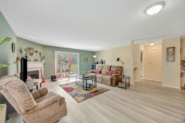 3435 Kleeman Lake Ct, Cincinnati, OH 45211 - living room with wood finished floors and a glass covered fireplace