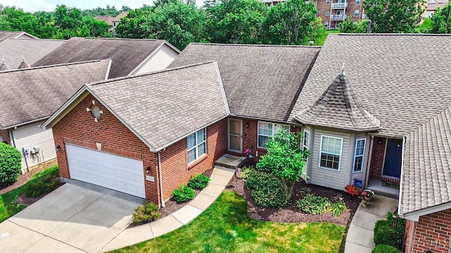 3435 Kleeman Lake Ct, Cincinnati, OH 45211 - view of front facade with brick siding, a shingled roof, and concrete driveway