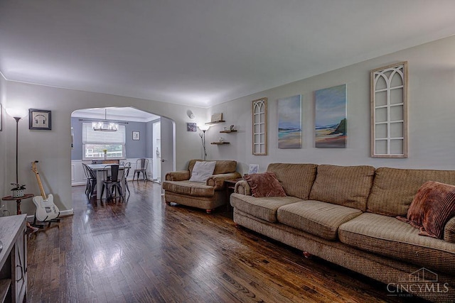 4213 Alex Ave, Cheviot, OH 45211 - living area with arched walkways, a chandelier, and dark wood-style floors