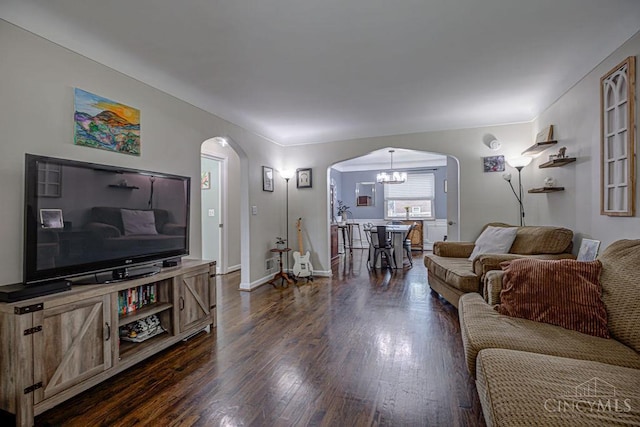 4213 Alex Ave, Cheviot, OH 45211 - living area with arched walkways, a chandelier, and dark wood finished floors