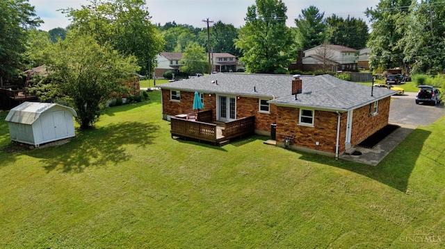 906 Shayler Rd, Union Twp, OH 45245 - rear view of property with a wooden deck, a shed, a yard, brick siding, and french doors