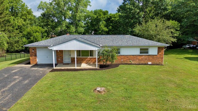 906 Shayler Rd, Union Twp, OH 45245 - single story home featuring brick siding, a garage, driveway, and roof with shingles