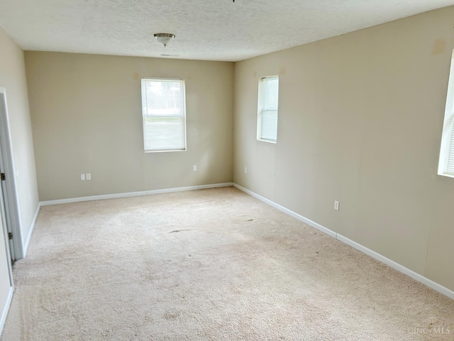 2247 Tucker Rd, Blanchester, OH 45107 - empty room featuring light colored carpet and a textured ceiling