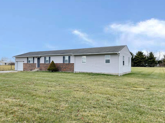 2247 Tucker Rd, Blanchester, OH 45107 - ranch-style house featuring a garage, a front lawn, and brick siding