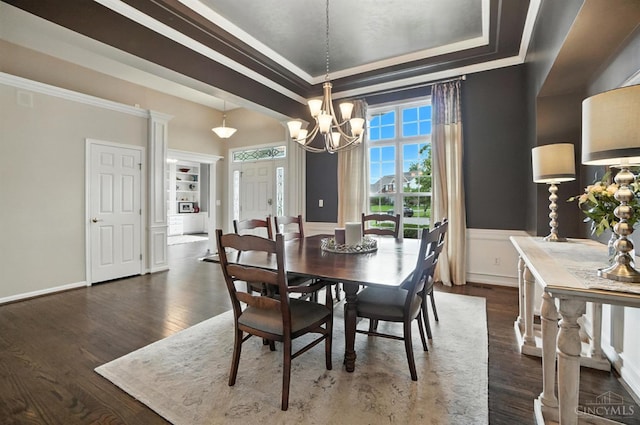 4048 Frye Park Cir, Mason, OH 45040 - dining room featuring a raised ceiling, a chandelier, dark wood-type flooring, ornamental molding, and wainscoting