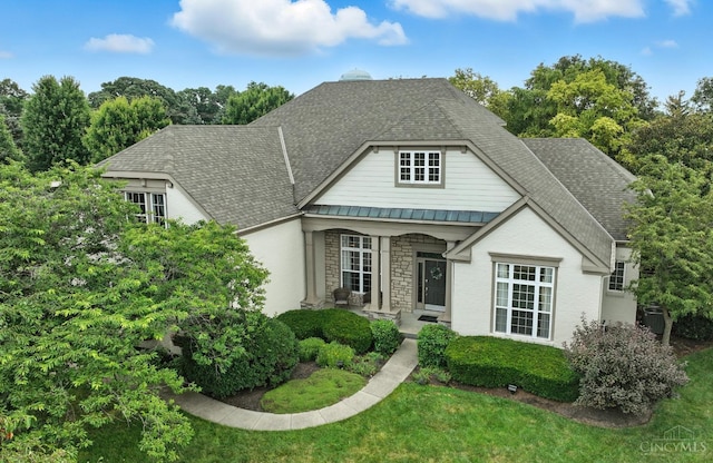 4048 Frye Park Cir, Mason, OH 45040 - view of front of home with a standing seam roof, a metal roof, stone siding, a shingled roof, and covered porch