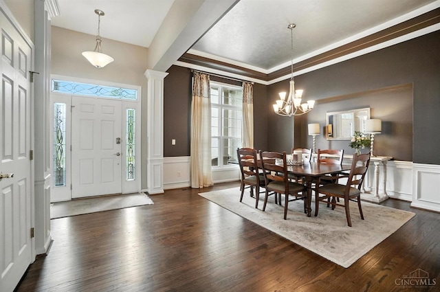 4048 Frye Park Cir, Mason, OH 45040 - dining area featuring a decorative wall, dark wood-style floors, wainscoting, a chandelier, and ornate columns
