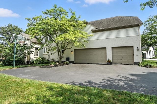 4048 Frye Park Cir, Mason, OH 45040 - view of front of home with driveway, brick siding, and an attached garage