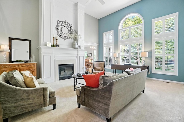 4048 Frye Park Cir, Mason, OH 45040 - living room with light colored carpet, a high ceiling, and a fireplace