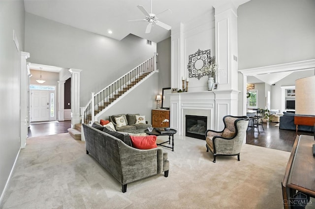 4048 Frye Park Cir, Mason, OH 45040 - living area with a towering ceiling, plenty of natural light, ornate columns, stairs, and ceiling fan