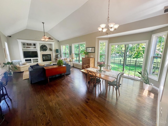 4048 Frye Park Cir, Mason, OH 45040 - dining room with dark wood-style flooring, ceiling fan, vaulted ceiling, a glass covered fireplace, and a chandelier