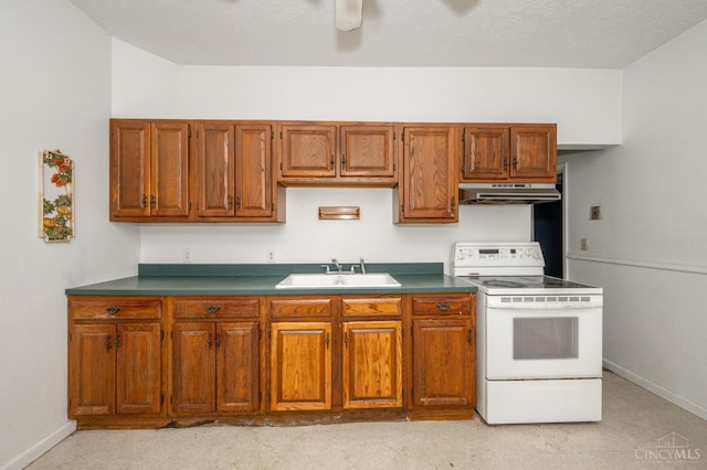 5653 Prosser Ave, Elmwood Place, OH 45216 - kitchen with electric stove, under cabinet range hood, brown cabinets, ceiling fan, and light carpet