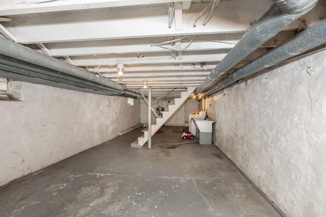 5653 Prosser Ave, Elmwood Place, OH 45216 - unfinished below grade area with stairs and washer / dryer