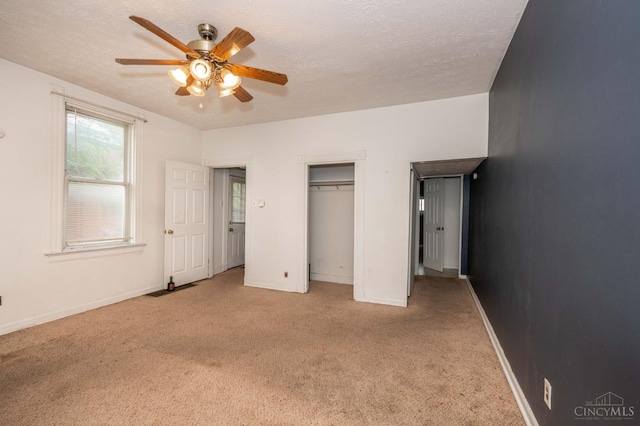 5653 Prosser Ave, Elmwood Place, OH 45216 - unfurnished bedroom with carpet floors, ceiling fan, a textured ceiling, and a closet