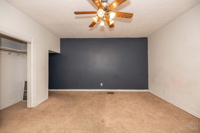 5653 Prosser Ave, Elmwood Place, OH 45216 - unfurnished bedroom featuring carpet, a textured ceiling, ceiling fan, and a closet