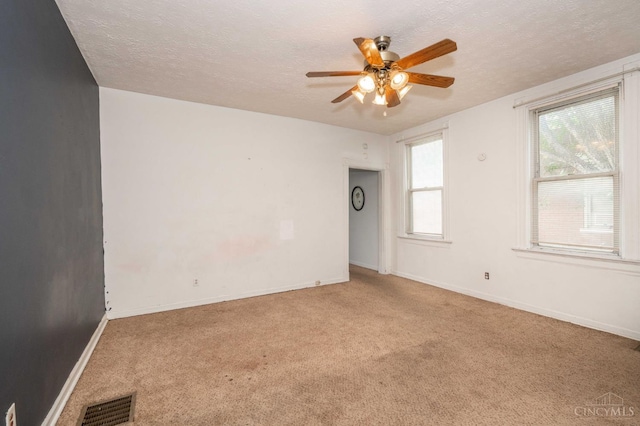 5653 Prosser Ave, Elmwood Place, OH 45216 - empty room with carpet flooring, ceiling fan, and a textured ceiling