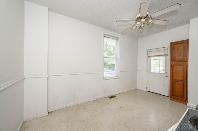 5653 Prosser Ave, Elmwood Place, OH 45216 - empty room featuring a ceiling fan and a textured ceiling
