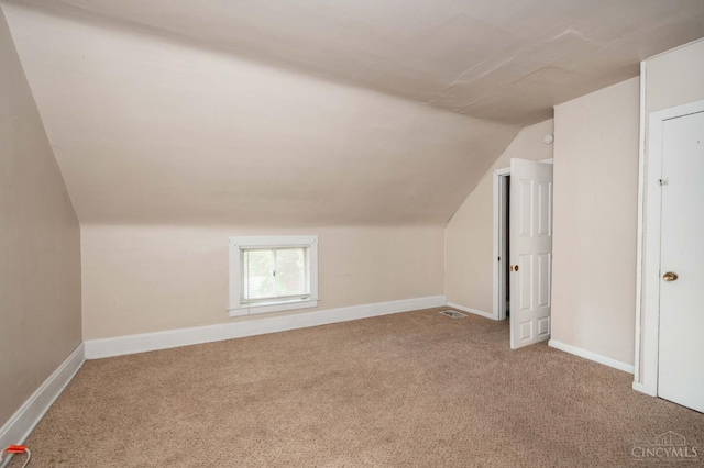 5653 Prosser Ave, Elmwood Place, OH 45216 - additional living space with vaulted ceiling and carpet floors