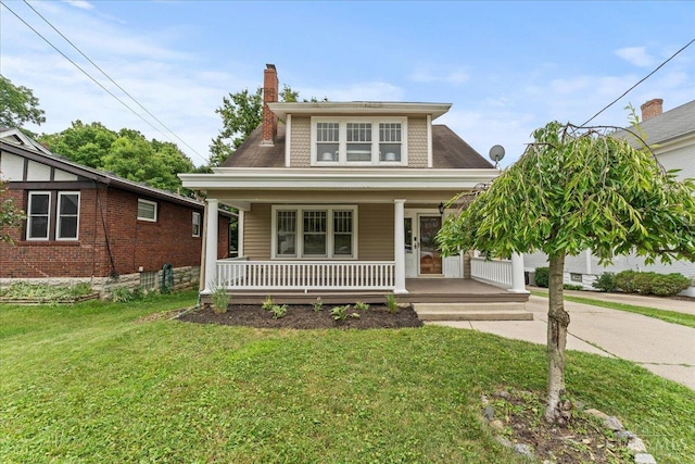 3131 Troy Ave, Cincinnati, OH 45213 - view of front of house with covered porch, a front lawn, and a chimney