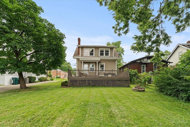 3131 Troy Ave, Cincinnati, OH 45213 - rear view of property with a yard, a chimney, and a wooden deck