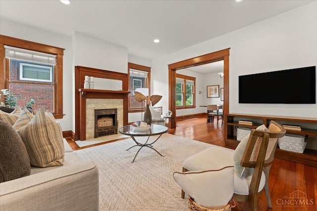 3131 Troy Ave, Cincinnati, OH 45213 - living room featuring wood finished floors, recessed lighting, and a tiled fireplace