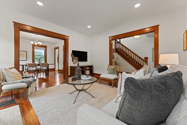 3131 Troy Ave, Cincinnati, OH 45213 - living room with wood finished floors, a chandelier, stairs, and recessed lighting