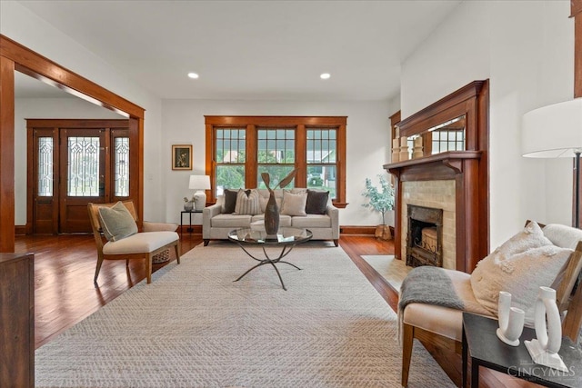 3131 Troy Ave, Cincinnati, OH 45213 - living area featuring wood finished floors, a fireplace with flush hearth, and recessed lighting