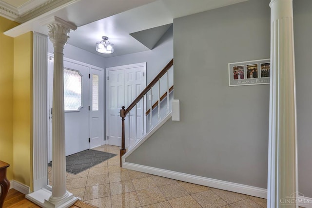 5681 Thomaridge Ct, Green Twp, OH 45248 - entrance foyer with ornate columns, stairway, and granite floors