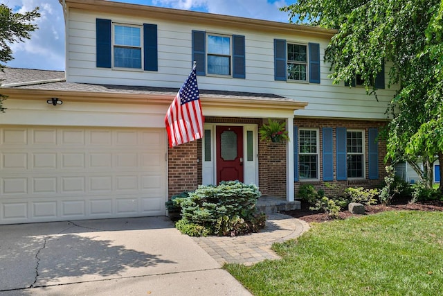 5681 Thomaridge Ct, Green Twp, OH 45248 - view of front facade featuring brick siding, concrete driveway, a front yard, a garage, and roof with shingles