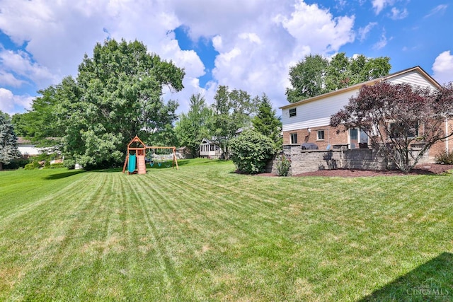 5681 Thomaridge Ct, Green Twp, OH 45248 - view of grassy yard with a playground