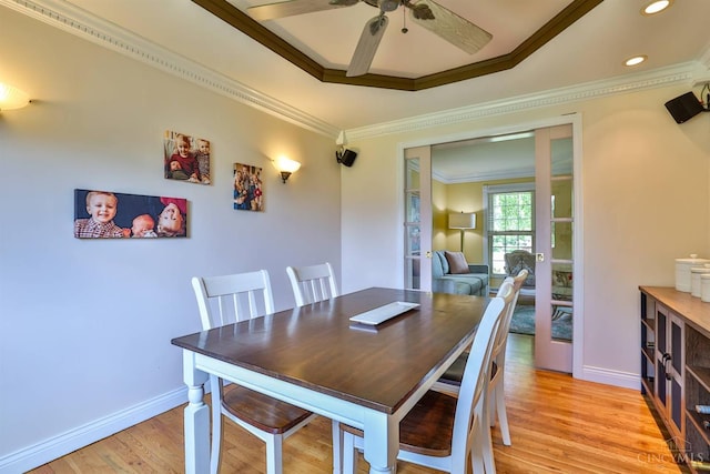 5681 Thomaridge Ct, Green Twp, OH 45248 - dining area featuring ornamental molding, ceiling fan, light wood-style floors, recessed lighting, and a tray ceiling