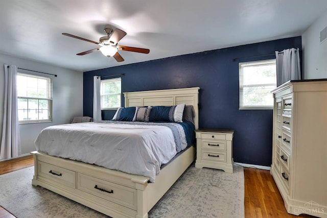 5681 Thomaridge Ct, Green Twp, OH 45248 - bedroom with wood finished floors and a ceiling fan