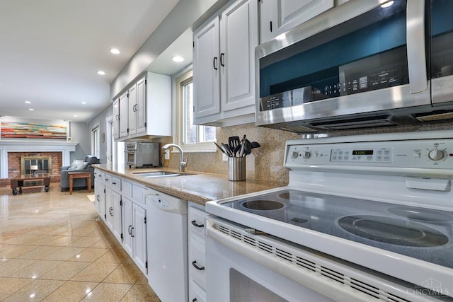 5681 Thomaridge Ct, Green Twp, OH 45248 - kitchen featuring white appliances, white cabinets, backsplash, recessed lighting, and light countertops