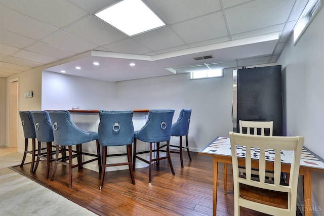 5681 Thomaridge Ct, Green Twp, OH 45248 - indoor dry bar with a paneled ceiling, freestanding refrigerator, wood finished floors, and recessed lighting