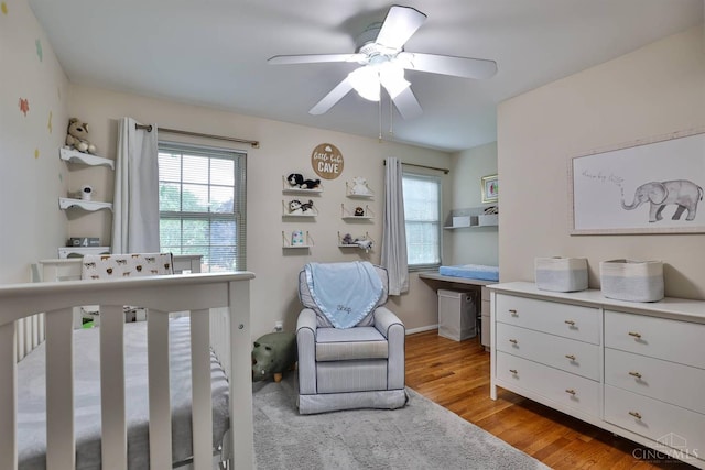 5681 Thomaridge Ct, Green Twp, OH 45248 - bedroom featuring multiple windows, light wood-type flooring, and a ceiling fan