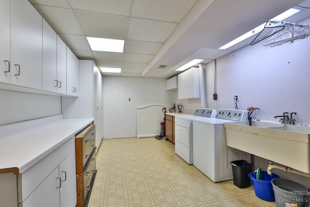 5681 Thomaridge Ct, Green Twp, OH 45248 - laundry room with cabinet space, washing machine and clothes dryer, and light floors
