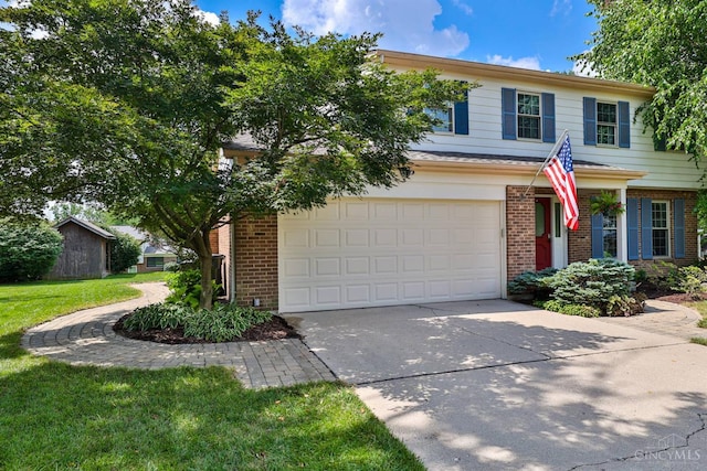 5681 Thomaridge Ct, Green Twp, OH 45248 - view of front facade featuring brick siding, driveway, a garage, and a front yard